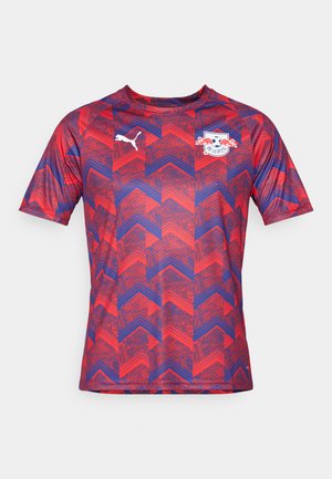 Rot und blau gemustertes Kurzarm-Sportshirt mit einem Zickzackdesign. Verfügt über ein Puma-Logo und ein Teamemblem auf der Brust.