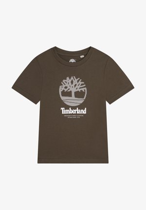 Camiseta marrón de manga corta hecha de algodón, con un logo de árbol gráfico blanco y el nombre de la marca centrados en el frente.