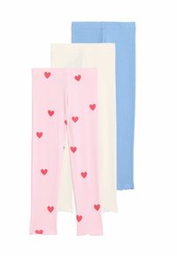 Trois paires de leggings : rose avec un motif de cœurs rouges, blanc uni et bleu clair uni. Mélange de coton, texture douce, coupe droite, ourlets effilochés.