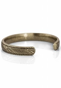Bracciale in bronzo con superficie testurizzata che presenta un motivo lineare ondulato. Design aperto e bordi lisci per il massimo comfort.