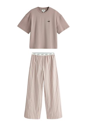 Short-sleeve beige top with "self." logo and light beige wide-leg pants with thin vertical stripes and a branded elastic waistband.