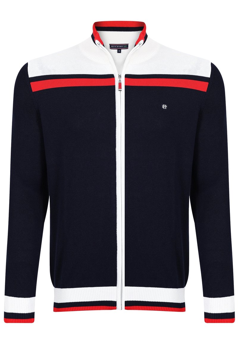 Námořnická modrá mikina na zip s bílými a červenými pruhy přes ramena, manžety a spodní lem, s malým bílým vyšitým logem na hrudi.