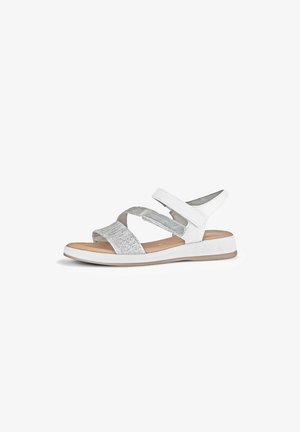Sandali bianchi con cinturini intrecciati argento, chiusure regolabili in velcro e suola piatta in gomma. Design leggero per comfort e facilità d'uso.