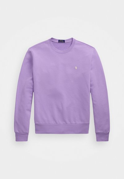 Sweatshirt roxo com punhos e barra canelados, apresentando um pequeno logótipo bordado no peito. Tecido macio e suave.