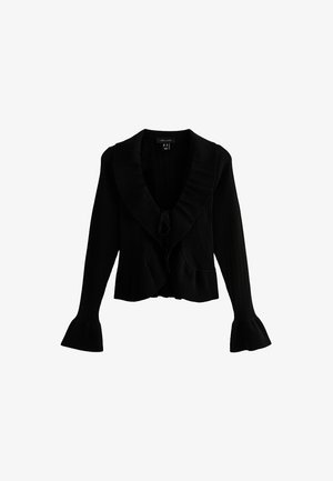 Zwarte gebreide cardigan met een brede, gegolfde kraag, striksluiting en uitlopende mouwen. Heeft een ribbeltextuur en een cropped lengte.