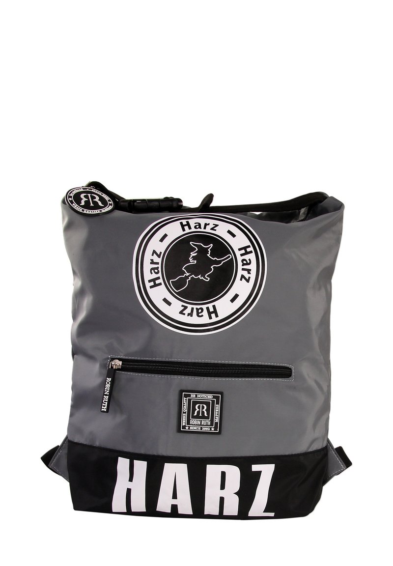 Gray and black backpack with a glossy finish. Features a front zip pocket and circular logo with text. Large "HARZ" print on the bottom.