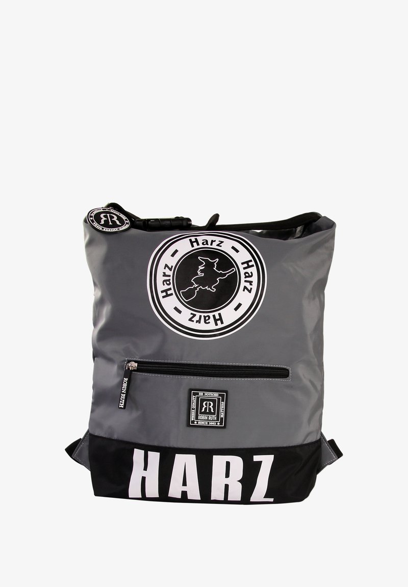 Gray and black backpack with a glossy finish. Features a front zip pocket and circular logo with text. Large "HARZ" print on the bottom.