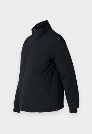 Jachetă padded neagră cu guler stând, buzunare laterale și manșete elastice. Dispune de un fermoar frontal și o textură netedă.