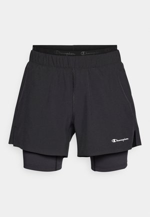 Pantaloni scurți atletici negri cu strat interior, talie elastică, logo pe piciorul inferior și fante laterale pentru mișcare și respirabilitate îmbunătățite.