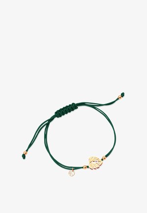 Zielona bransoletka z kordelka z zawieszką w kształcie złotej liści i małymi złotymi koralikami, z zaciskiem przesuwanym do regulacji rozmiaru.