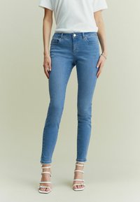 Next Liibuvad teksad - mid blue