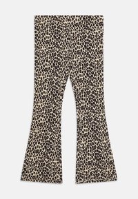 Leggings évasés en tissu beige avec un motif léopard noir et marron. Dotés d'une taille ajustée et d'un matériau extensible.