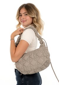 Quilted beige shoulder bag with a puffy design, featuring a ruched handle and a smooth texture, showcasing diamond patterns.