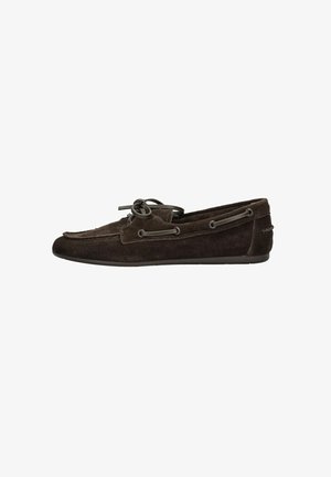 Dark brown suede moccasin with a flat sole, featuring a lace detail around the upper and metal eyelets for a secure fit.