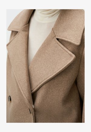 Double-breasted wool coat in light brown. Features wide lapels, textured fabric, and two round buttons near the hem.