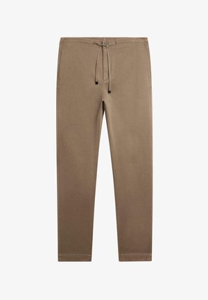Bruna byxorna med dragsko, med en avsmalnande design, tillverkade av mjukt tyg. Har sidofickor och subtila sömnadsdetaljer.