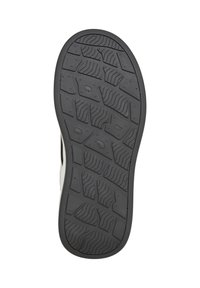 Semelle d'une chaussure noire avec une bande de roulement texturée et à motifs multiples pour la traction et l'adhérence sur diverses surfaces.