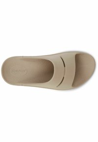 Beige slip-on shoe with two cut-out straps, textured insole, and a smooth upper surface. Made of flexible material, ideal for comfort.