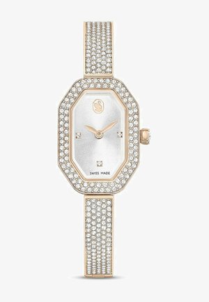 Reloj octogonal con una esfera plateada, acentos en oro rosa y brillantes piedras de strass en el bisel y la pulsera para un efecto brillante.
