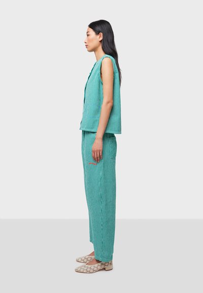 Turquoise striped sleeveless top and matching pants with a relaxed fit; features side pockets and subtle red embroidery detail.