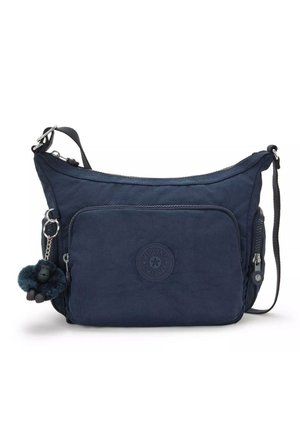 Navy blue shoulder bag made from soft fabric, featuring a front zip pocket, textured surface, and a gorilla keychain accessory.