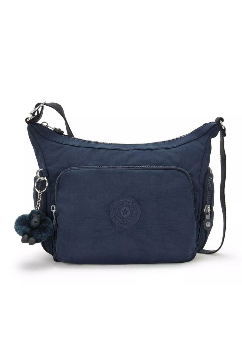 Borsa a spalla blu navy realizzata in tessuto morbido, con tasca frontale con zip, superficie testurizzata e un portachiavi a forma di gorilla.