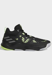 Chaussure de sport noire et verte néon avec un design en mesh, une semelle épaisse et trois bandes grises au talon sur fond blanc.
