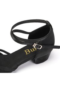 Black fabric sandal with a low block heel, thin ankle straps, and a silver buckle. Features a soft footbed with gold brand logo.