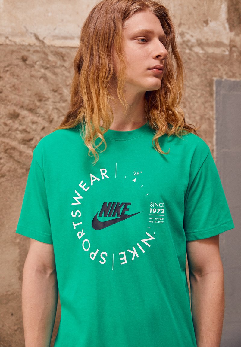 stadium green nike shirt