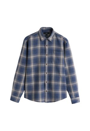 Chemise à carreaux avec un motif bleu et beige, manches longues, fermeture boutonnée à l'avant, et une poche poitrine unique. Fabriquée en tissu doux.