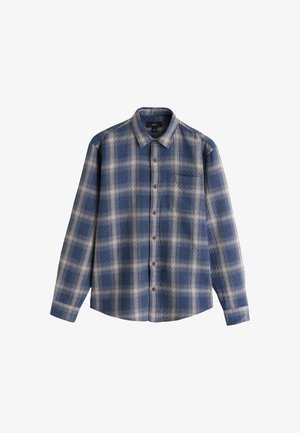 Chemise à carreaux avec un motif bleu et beige, manches longues, fermeture boutonnée à l'avant, et une poche poitrine unique. Fabriquée en tissu doux.