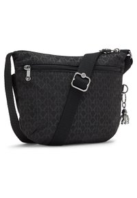 Black nylon crossbody bag featuring a geometric pattern, adjustable strap, front zip pocket, and silver-tone hardware with a charm accent.