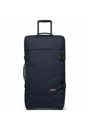 Navy blue wheeled duffel bag with a rectangular shape, made of durable fabric, featuring side handles, and two adjustable buckles.