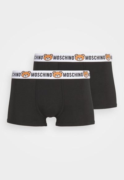Boxer-briefs noirs avec une ceinture blanche, ornés d'un graphique d'ours et du texte "MOSCHINO". Fabriqués en tissu lisse ; design à jambe courte.