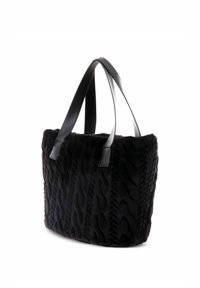 Borsa tote in pelliccia sintetica nera con motivo a onde testurizzato, dotata di manici neri lisci in materiale sintetico e design con apertura superiore.