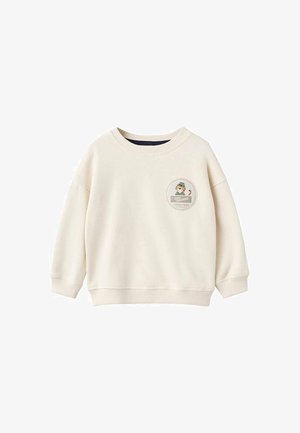 Sweatshirt à manches longues couleur crème pour tout-petit avec col rond et petit patch rond présentant un tigre de dessin animé et le texte "Tiny Trekker Safari Trail."