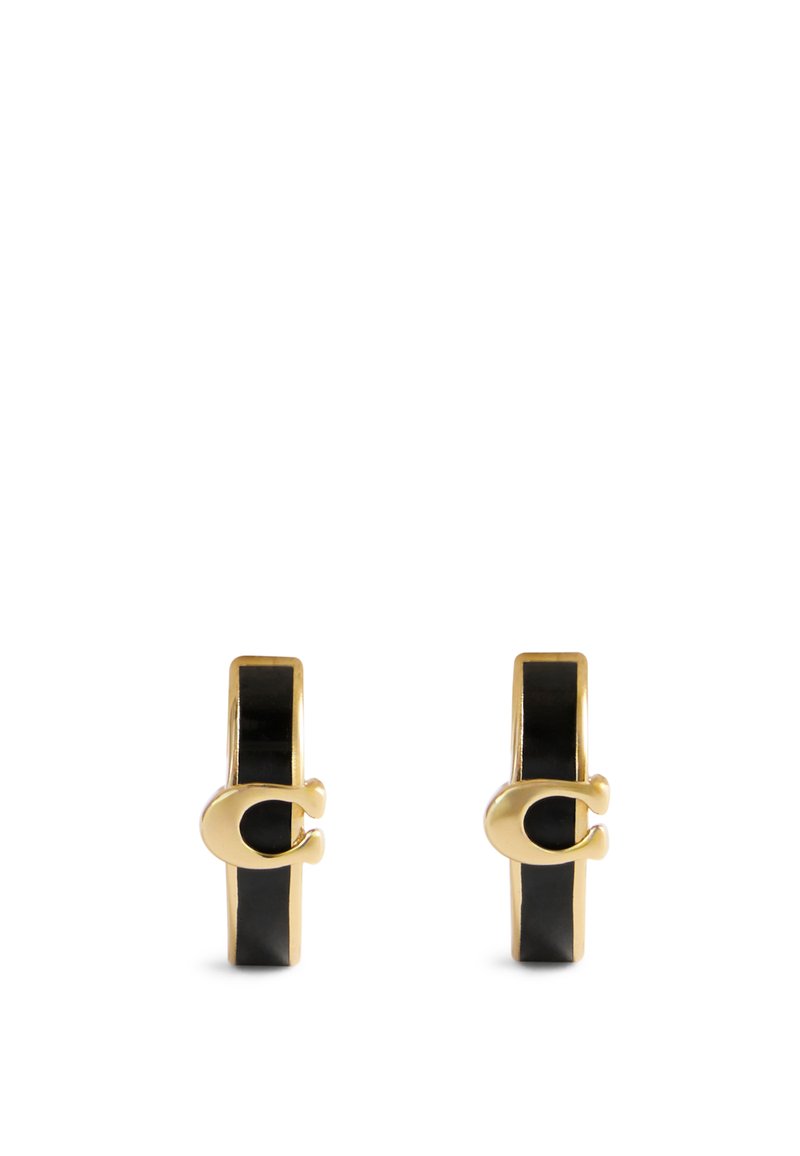 Gold-tone hoop earrings featuring a sleek black enamel band and a distinctive clasp design, showcasing a glossy finish and modern aesthetic.