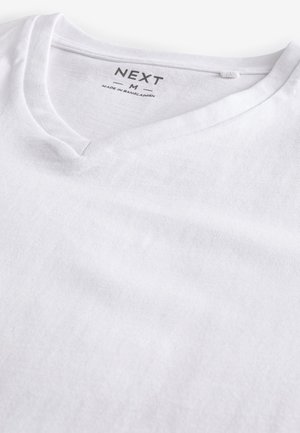 Witte katoenen v-hals t-shirt met een zachte textuur. Heeft een label met "NEXT" en maat "M" gedrukt aan de binnenkant van de halslijn.