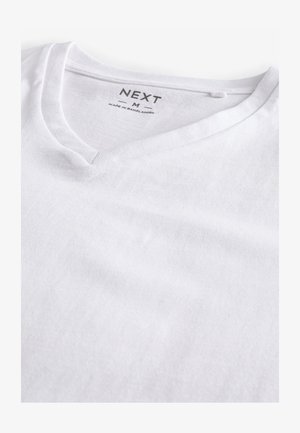 Witte katoenen v-hals t-shirt met een zachte textuur. Heeft een label met "NEXT" en maat "M" gedrukt aan de binnenkant van de halslijn.