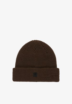 Brown knitted beanie hat with a textured pattern, featuring a folded cuff and a small black logo tag on the side.