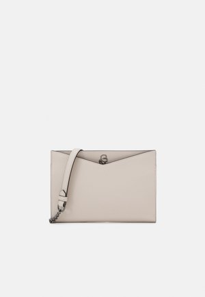 Beige rectangular leather clutch with a front V-shaped flap and short strap with metal chain detail on white background.