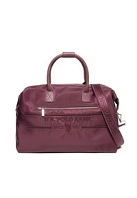 Punaruskea nailoninen duffel-laukku, jossa on kaksinkertaiset kahvat, irrotettava olkahihna, edessä vetoketjutasku ja kohokuvioitu logon yksityiskohta. Tasainen ja sileä pinta koko laukussa.