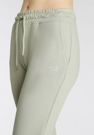 Lichtgroene sweatpants met een elastische tailleband, trekkoord, zijzakken en "H.I.S" geborduurd in een bijpassende kleur. Zachte gebreide textuur.