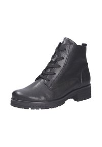 Bottes noires en cuir jusqu'à la cheville avec un bout arrondi, un laçage à l'avant et une semelle en caoutchouc texturée. Présente des accents de couture discrets.
