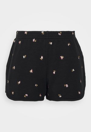 Schwarze lässige Shorts mit kleiner, mehrfarbiger Blumenstickerei und elastischem Bund, flach liegend vor weißem Hintergrund dargestellt.