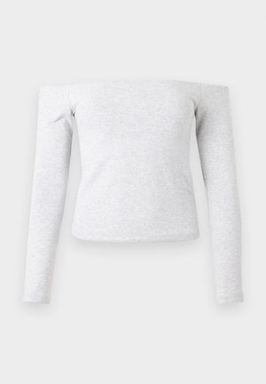 Lysegrå, tettsittende langermet skjorte med en skulderfri utringning. Laget av mykt, elastisk stoff med en jevn tekstur.