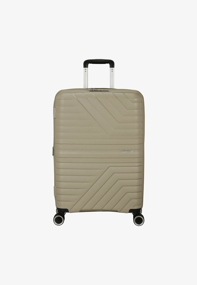 Valigia rigida beige con un design a strisce diagonali testurizzate. Dotata di quattro ruote multidirezionali e di un manico telescopico.