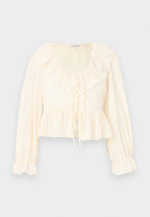 Εκρού μπλούζα μακρυμάνικη με πτυχώσεις στον γιακά, κορδέλες στο μπροστινό μέρος, μανσέτες με σούρες και ασύμμετρη βάση σε ελαφρύ υφασμάτινο ύφασμα με υφή.