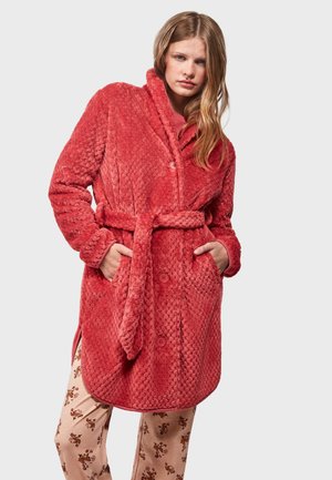 Red textured fleece robe with a tie waist, featuring a shawl collar and button closure. Model wears patterned pajama pants underneath.