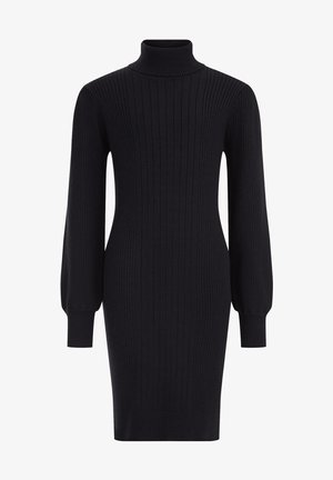 Robe noire en maille côtelée à manches longues avec col roulé et silhouette cintrée, s'arrêtant au-dessus du genou.